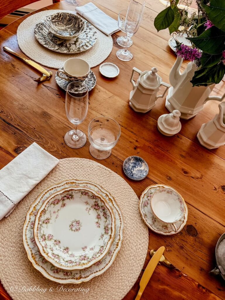 Family heirloom china place settings on vintage dining room table for summer into fall style.
