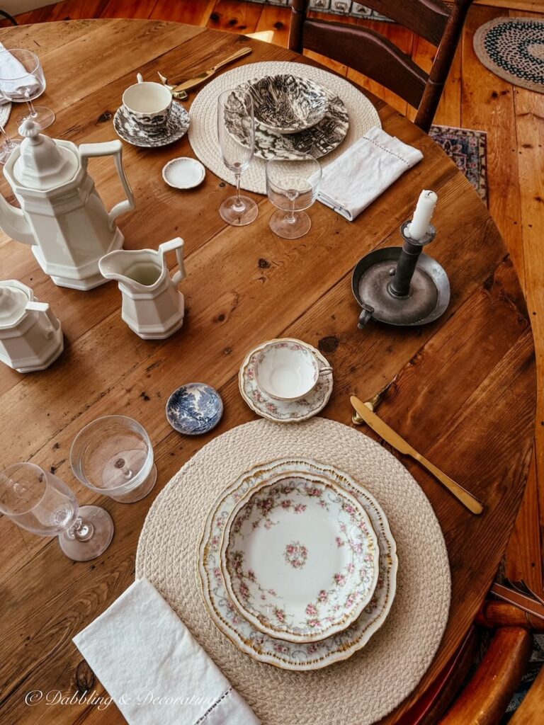 Vintage table setting with family heirlooms for a summer into fall tablescape in dining room.