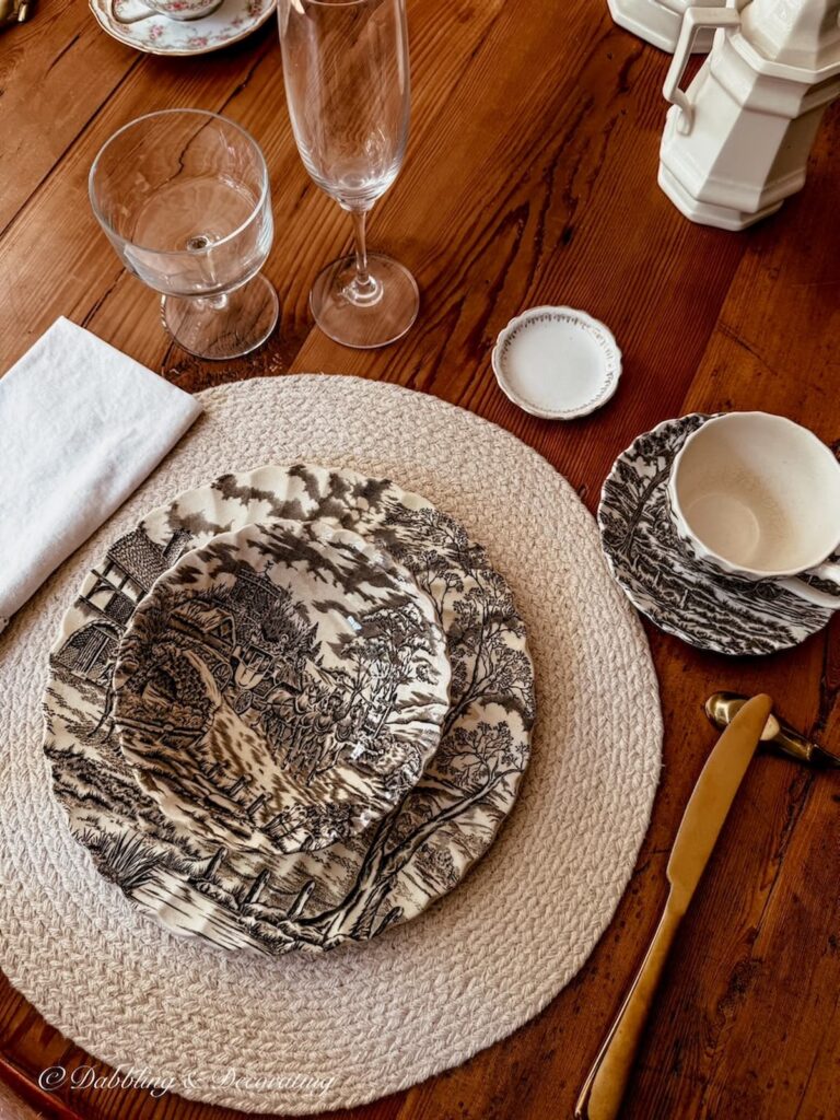 Brown and white transferware place setting on vintage tablescape for summer into fall.