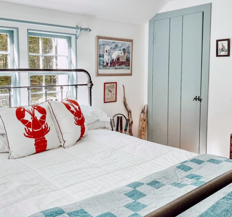 Guest bedroom in old colonial New England home with blue custom historic paint color on the trim with Simply white walls.