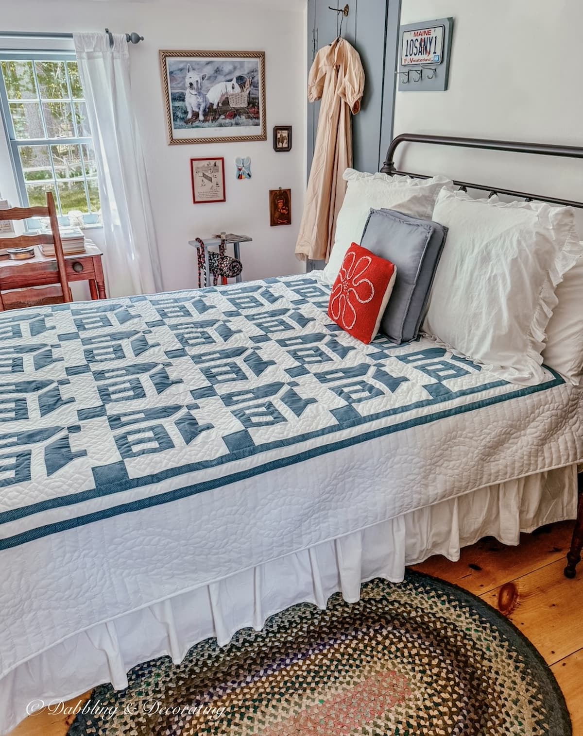 Small guest bedroom in old New England colonial home with custom blue historic paint color on trim and Simply white walls.  Amish quilt on wrought iron bed.