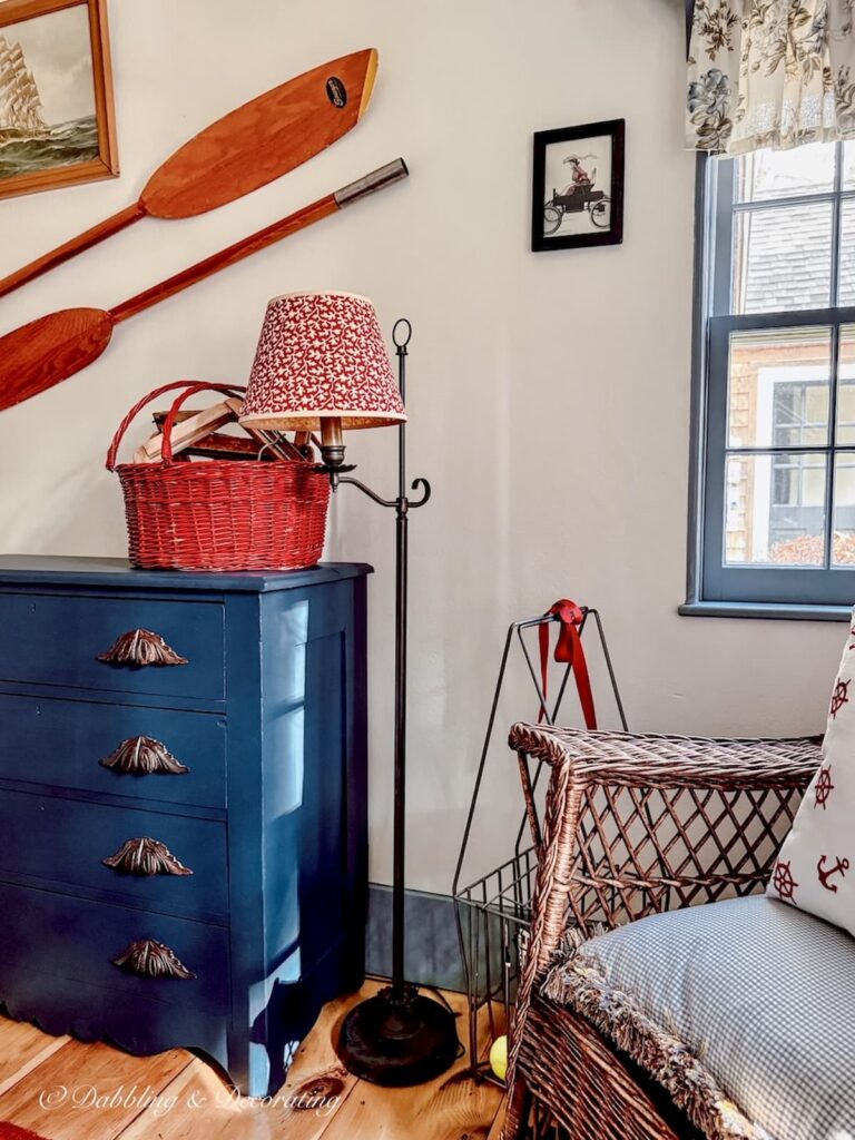 Small guest bedroom with vintage charm in red, white, and blues in old colonial home.
