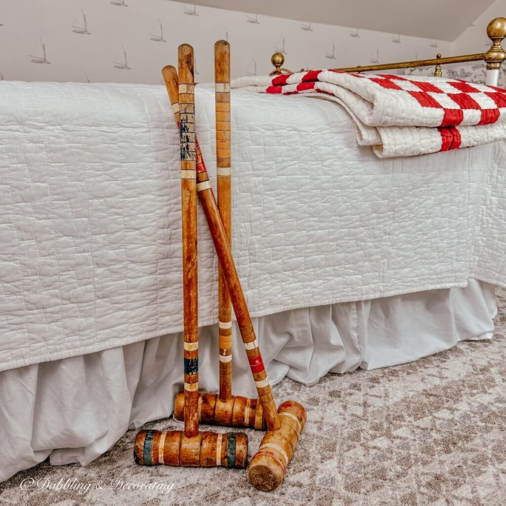 Thrifted bedroom ideas with vintage croquet mallets and thrifted finds for a bedroom Makeover.