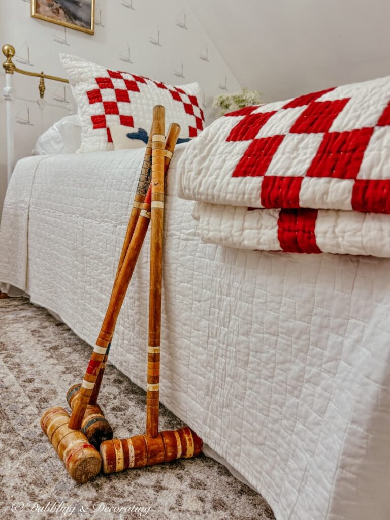 Thrifted bedroom ideas with vintage croquet mallets and thrifted finds for a bedroom Makeover.
