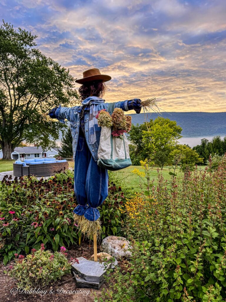 Moxie Mae my thrifted in blue fall scarecrow in the mountains on a misty morning in Vermont.