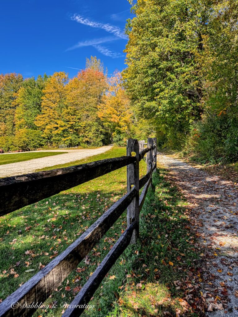 Split rail fence weathered in Vermont on the Manchester Rail Trail in early fall foliage season.