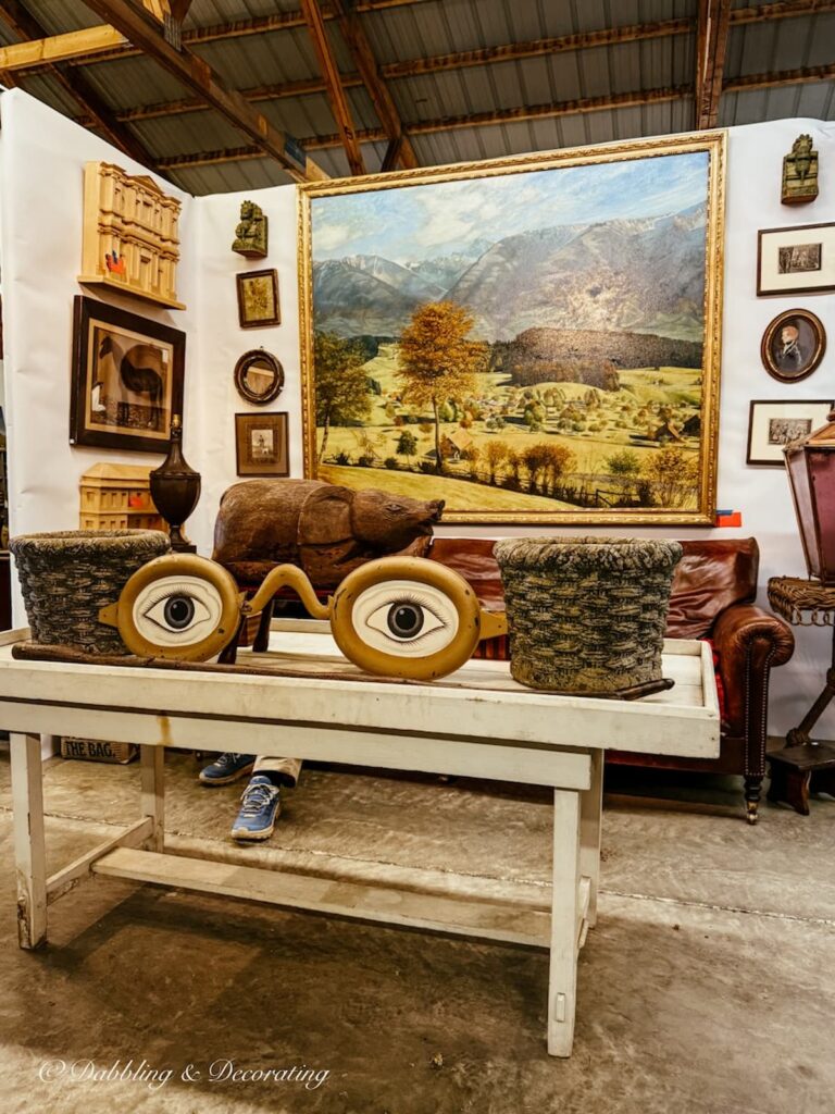 Antique wall art inside High-End Antique Booths at Taconic Antiques Fair in Chatham, New York.