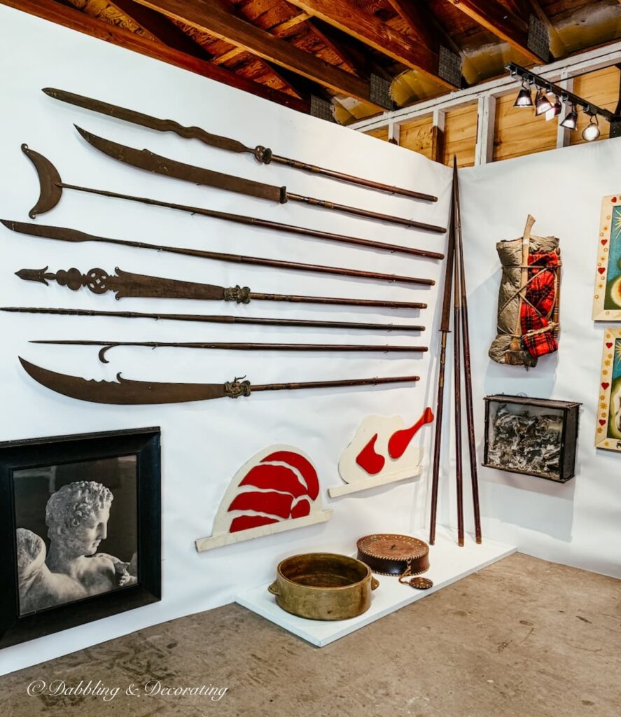 Antique wall display inside High-End Antique Booths at antiques fair (antique swords)