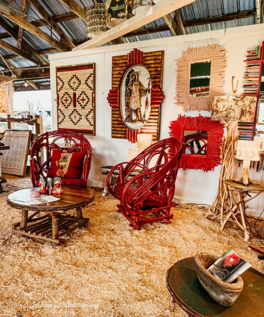 Country Living Fair Indigenous booth with beautiful red woven chairs, artwork and more.