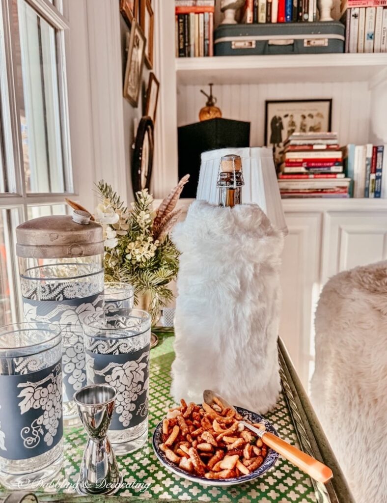 How to dress up a wine bottle with a white Amazon hand muff on vintage bar cart.