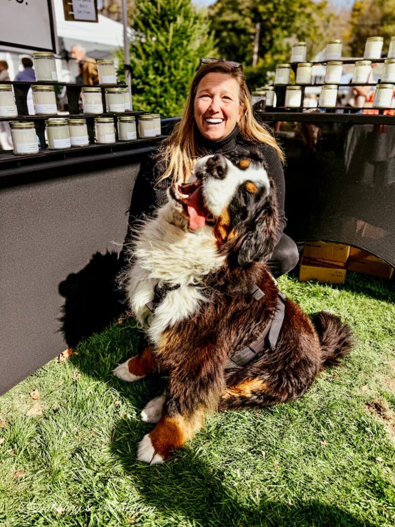 Christina of Hayden Rowe Soy Candles at the Dorset Fair in Vermont with Ella, our Bernese Mountain Dog.