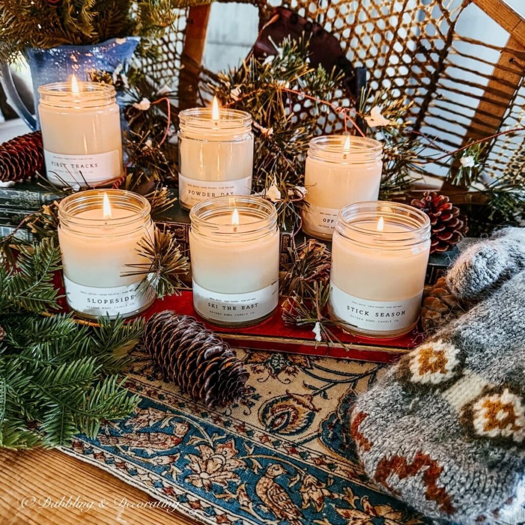 6 Hayden Rowe Vermont Candles with ski lodge scents in vintage ski lodge vignette.